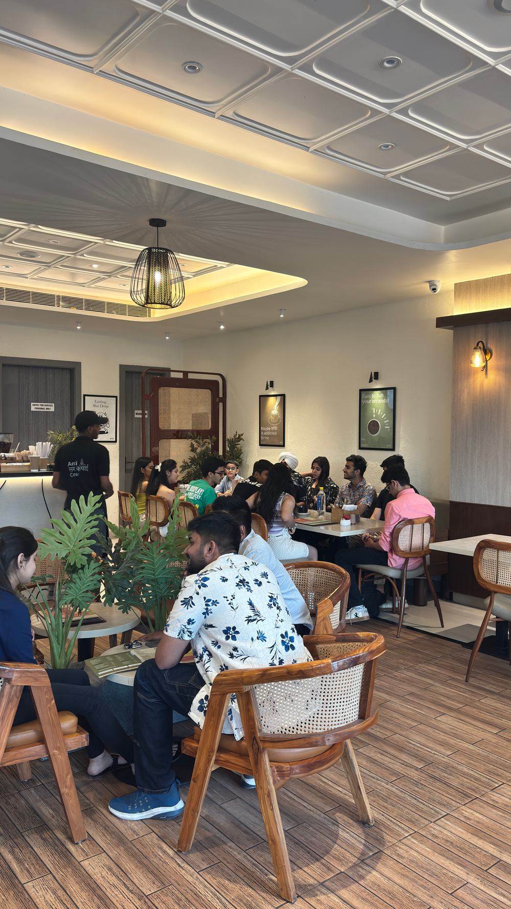 Customers seated inside Kapai Coffee House