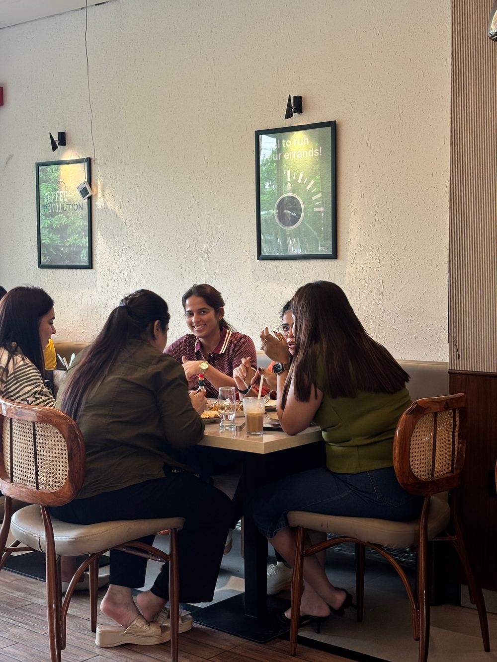Friends catching up over coffee at Kapai